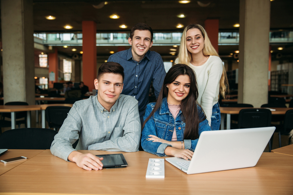 College Students with Laptop Studying in the School Library